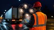© Aamir - Construction worker in orange vest and red helmet holding tablet at night with glowing technology symbols above, showcasing smart cities and AI driven traffic systems