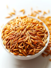 Wall Mural - Raw brown rice in a bowl on white background. Close up.