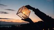 © Justlight - Woman gently lifting glowing cube lantern at sunset, creating a magical atmosphere of warmth, hope, and wonder against a backdrop of city lights