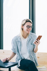 Wall Mural - happy hipster blogger enjoying web communication with social followers connecting to 4g wireless int