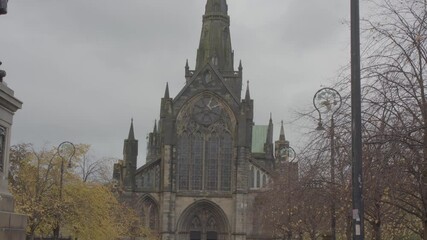 Wall Mural - Pan footage of the Glasgow Cathedral against cloudy sky during daytime in Glasgow city, Scotland, UK