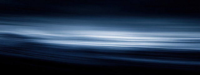 Wall Mural - A dark blue ocean with a few white clouds