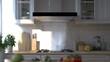 © Suphawan - View of a ductless electric hood exhaust operating in an eco-friendly, compact kitchen space.