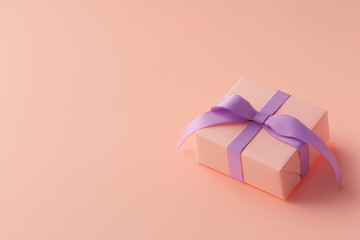 Wall Mural - Pink gift box with purple bow on pink background. Gift for Valentine's Day.