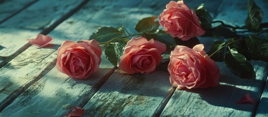 Poster - pink roses elegantly arranged on a rustic wooden table with soft light creating a serene and romanti