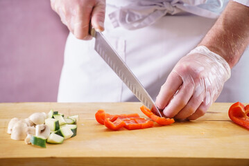 Wall Mural - .Chef cutting fresh and delicious vegetables for cooking