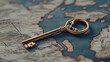 © Kevin - Ancient Golden Key on an Old Map. Finding Success