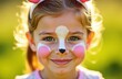 © kilimni - Portrait of caucasian girl smiling, with bunny or rabbit animal face painting and ears, sunny blurred background. Easter concept. Events and entertainment for children. Kid's birthday party or weekend