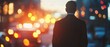 © fourtakig - Dynamic urban scene asian businessman navigating city streets with bokeh traffic effect