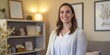 © Christopher - Portrait of female family therapist standing warmly in counseling room, offering support, professional shot
