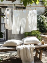 Leinwandbilder - Freshly washed linen hanging gracefully on a clothesline in a sunny outdoor garden setting. Generative AI