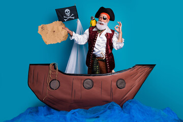 Photo of funny hilarious pirate wearing traditional costume sea adventure wooden boat isolated on blue color background