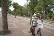 © Antonio - Two middle-aged women strolling through the center of a small Spanish town on a cold winter day
