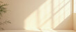 © Carina - Parede bege minimalista para apresentação do produto com luz vasp de planta e sombra intrincada da janela e vegetação na parede