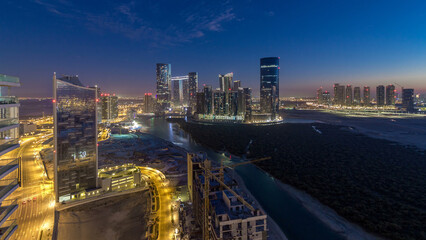 Wall Mural - Buildings on Al Reem island in Abu Dhabi day to night timelapse from above.