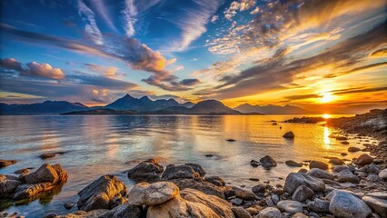 Wall Mural - sunset over a rocky shore with distant mountains in low angle view