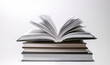 © pankajsingh - open book on white, pile of books