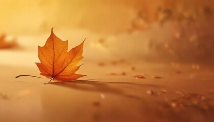 Single autumn leaf on an abstract orange background with a subtle glow and warm lighting, glow, color