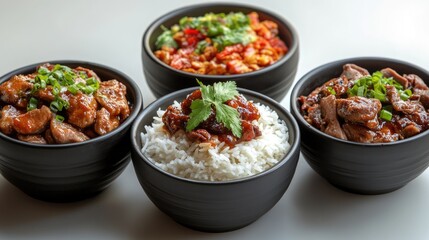 Wall Mural - Four bowls presenting delicious asian food with rice, meat and vegetables