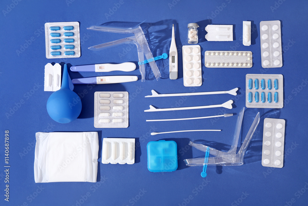 Set of gynecological supplies on blue background