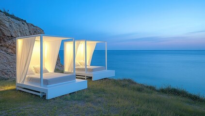 Poster - Two elegant outdoor beds overlooking a serene ocean at dusk.