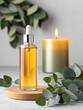 © n3wttfoto - Herb-infused essential oil bottle with eucalyptus candlelight ambience aromatherapy setting calm environment