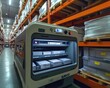 © Espresso - A high-tech automated storage system in a modern warehouse setting, showcasing efficiency in inventory management.