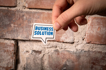 Wall Mural - business solution. speech bubble with text on red brick background