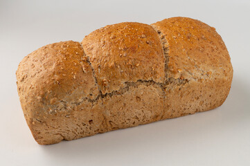 Generated imWhole wheat flour bread loaf with flaxseed isolated on white backgroundage