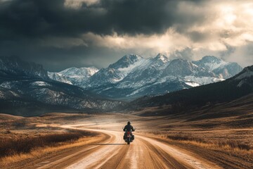 Enduro enthusiasts tackle cold, cloudy conditions on rugged mountain trails, exemplifying extreme sports and an active lifestyle in off-road touring.