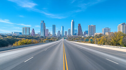 Poster - Empty highway leading towards modern city skyline under a bright blue sky