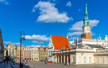 Wall Mural - View of historic building of Weighing house and Town Hall in centre of Poznan Market Square in sunny spring day, Poland