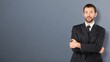© BillionPhotos.com - Happy smart business man posing at background.