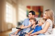 © BillionPhotos.com - Family, mom dad with child watching a TV