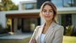 © btiger - Confident Real Estate Agent Woman Poses Outside Modern Suburban Home Ready to Assist Buyers