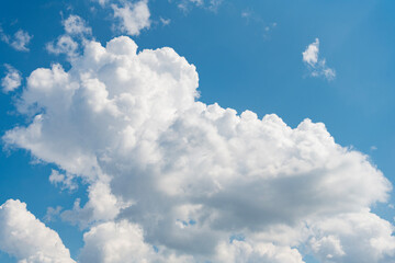 Wall Mural - Blue sky with clouds in the sky. Sky clouds background. White cloudy Heaven with soft sun light. Clouds on pastel blue sky background.
