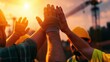 © kwangze - A close-up of construction workers celebrating with high-fives during sunset, showcasing teamwork and camaraderie on a job site.