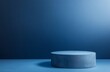 © adri - Blue cylindrical pedestal on blue background.