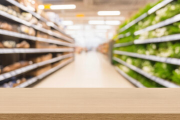 Wall Mural - empty  wooden board empty table in front of blurred background. Perspective light wood over blur in supermarket. mock up used for display or montage your products. Wood floor and Supermarket blur.