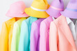 © zamuruev - Bright pastel jackets and hats bring a cheerful spring vibe, showcasing a diverse fashion palette for all occasions