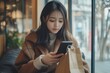 © Rising Monk - Digital smart lifestyle concept, Young Asian Adult female using shopping app via internet network at home, Generative AI