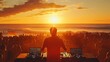© gita - DJ silhouetted at sunset, playing music to a large crowd on the beach.