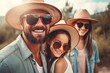 © nsit0108 - Family wearing sunglasses and summer hats smiling and enjoying a sunny day outdoors