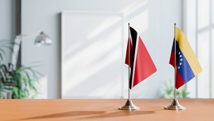 FLAGS OF TRINIDAD AND VENEZUELA ON TABLE