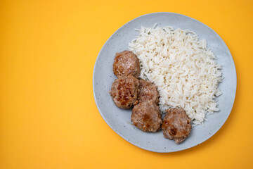 Sticker - Homemade meatballs with boiled rice on plate