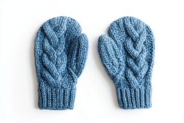 Wall Mural - Blue knitted cable mittens on white background