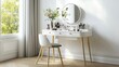 © azi - White vanity table with mirror, chair, makeup and flowers by window.