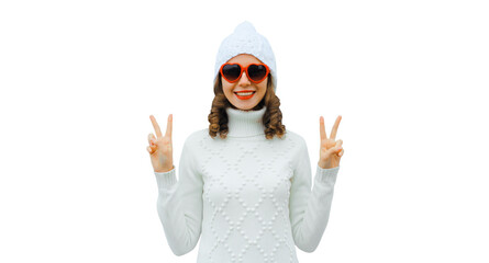 Poster - Winter portrait of happy young woman smiling with red heart glasses in white hat, sweater isolated