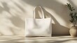 © The Little Hut - Chic White Tote Bag in Softly Lit Minimalistic Setting with Green Plant : Generative AI