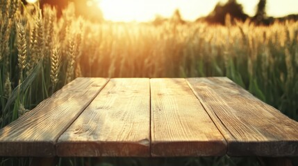 Wall Mural - A beautifully sunlit wooden table stands in a vibrant wheat field, capturing the essence of nature's warmth and peacefulness as the sun sets in the background.